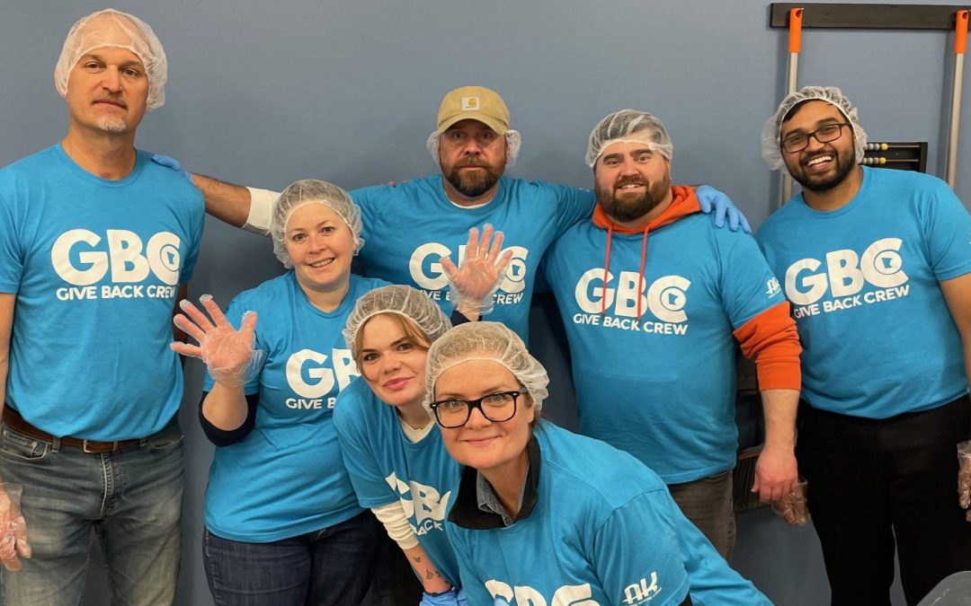 The Give Back Crew Packs Meals at Feed My Starving Children
